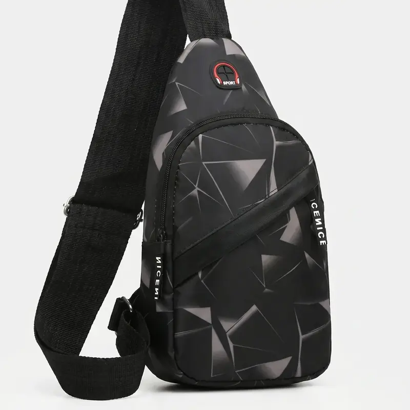 Borsttas – compacte crossbodytas met twee ritsvakken en grafische print
