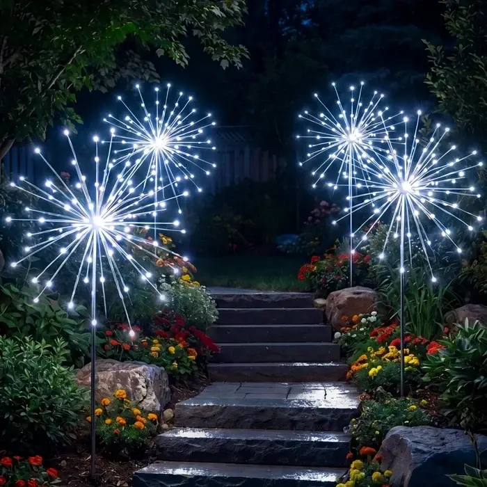 Tuinlamp op zonne-energie – sterrenregen van koelwit licht langs pad en border